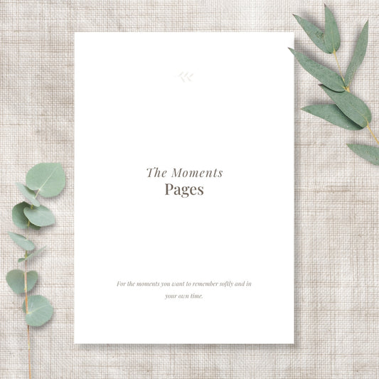 Pregnancy journal Moments collection title page displayed on a linen background with eucalyptus, designed for memory-keeping and reflective prompts.